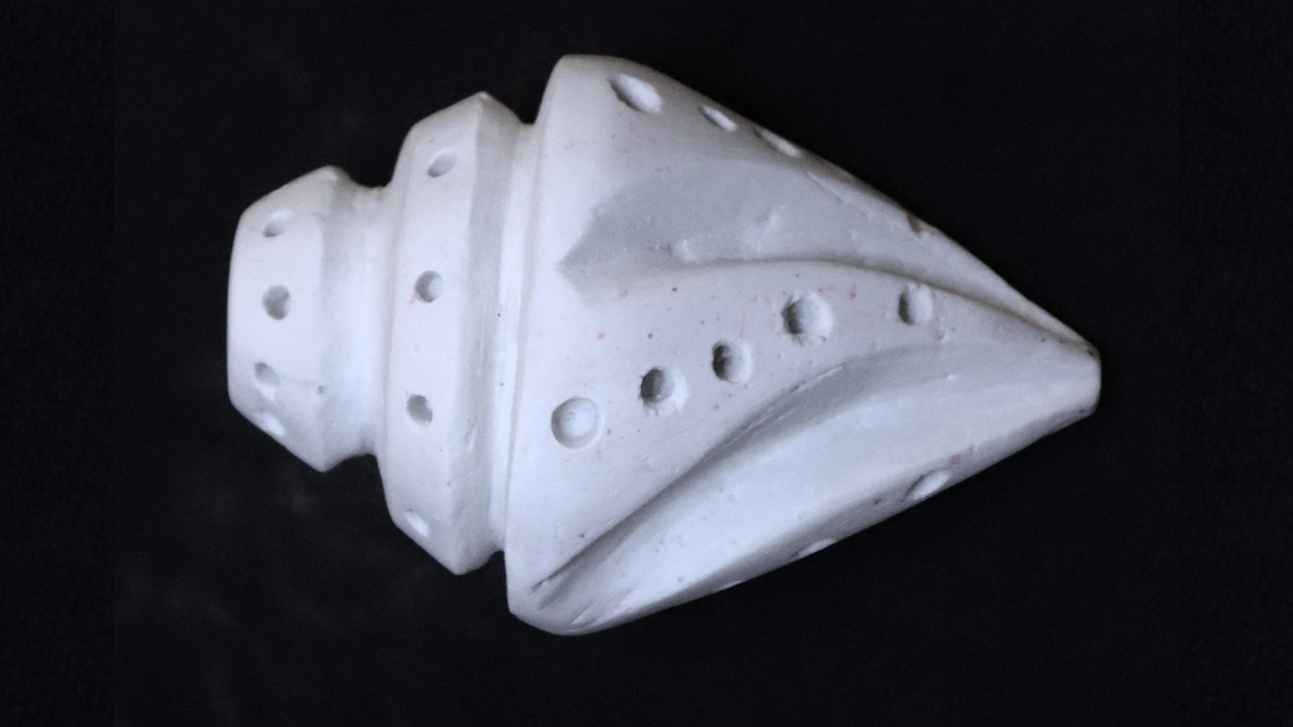 Side view of the final abstract seashell sculpture.