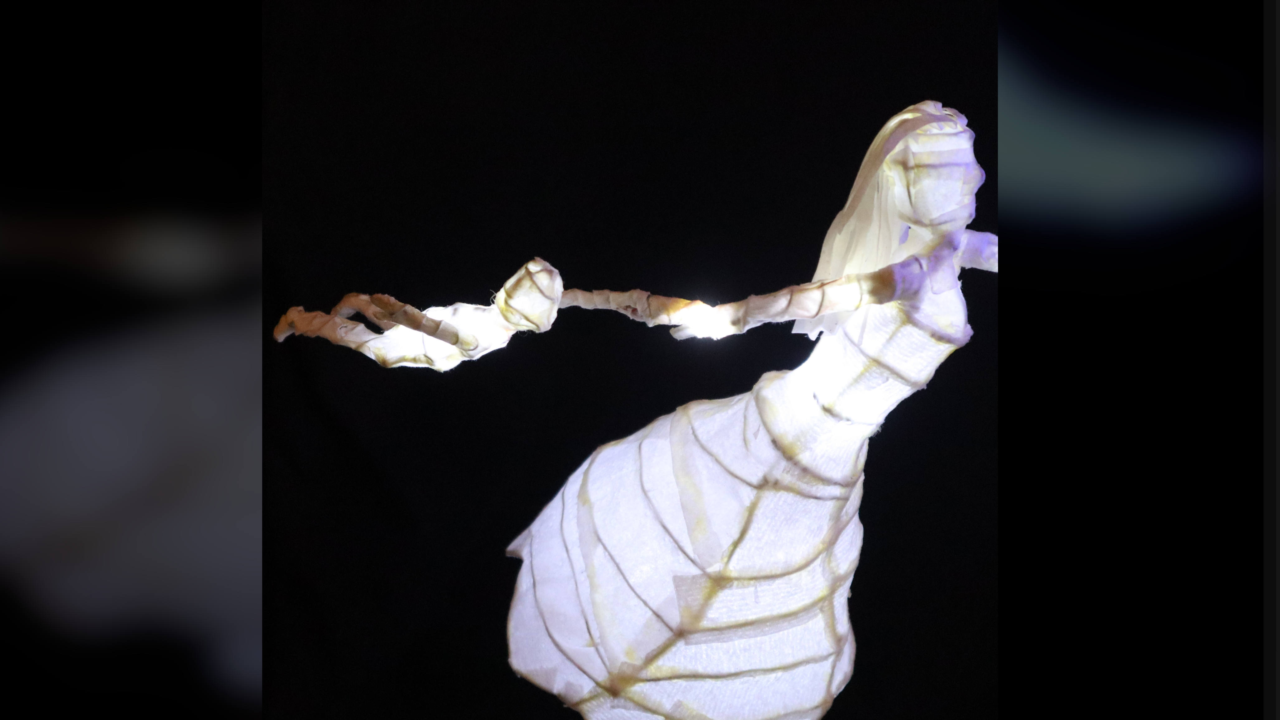 Close-up side view of the illuminated sculpture.