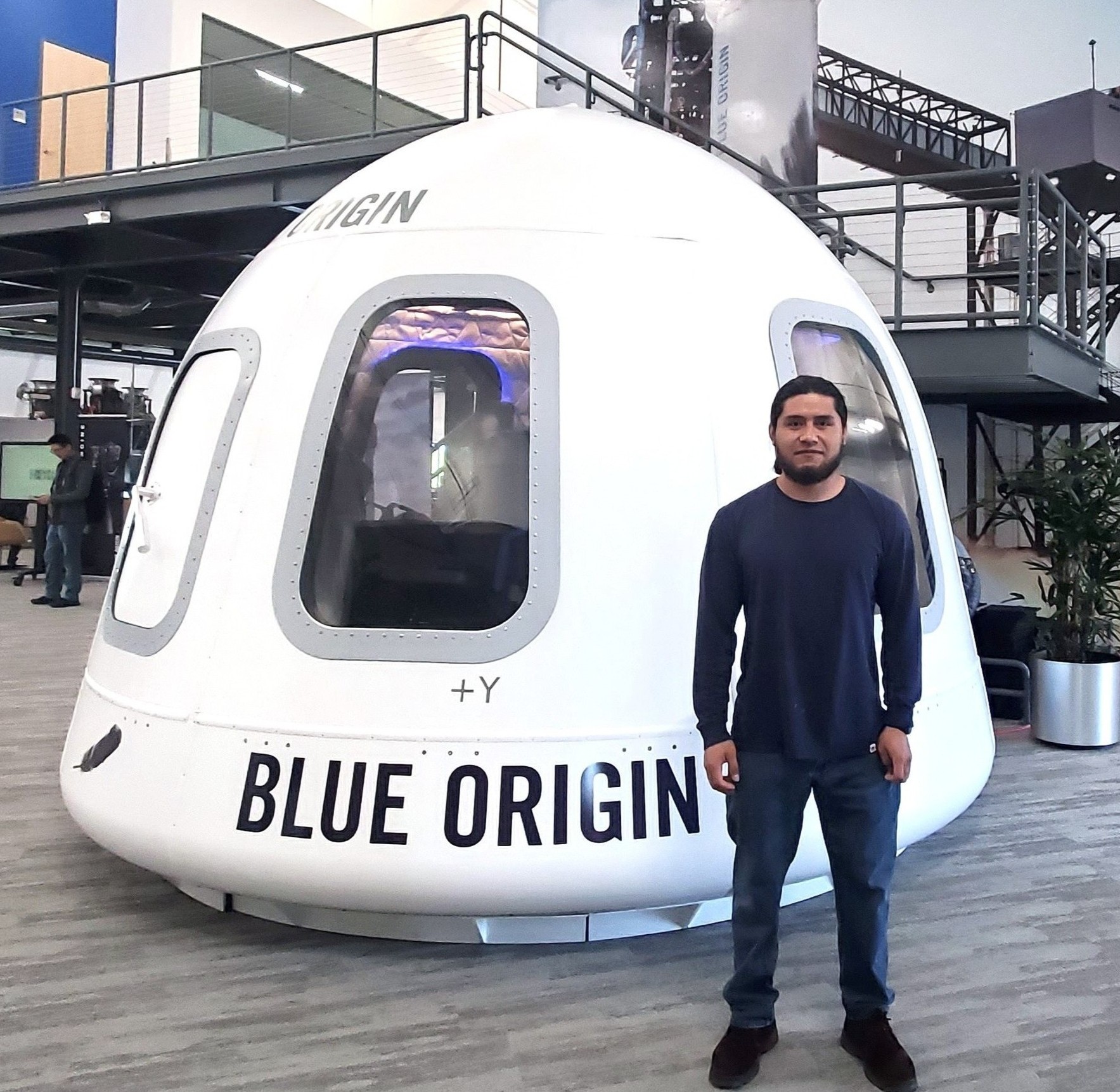 Me standing next to Blue Origin's New Shepard Capsule