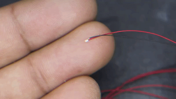 Gif showing the process of gluing one of the small leds to the LED NFC tag.