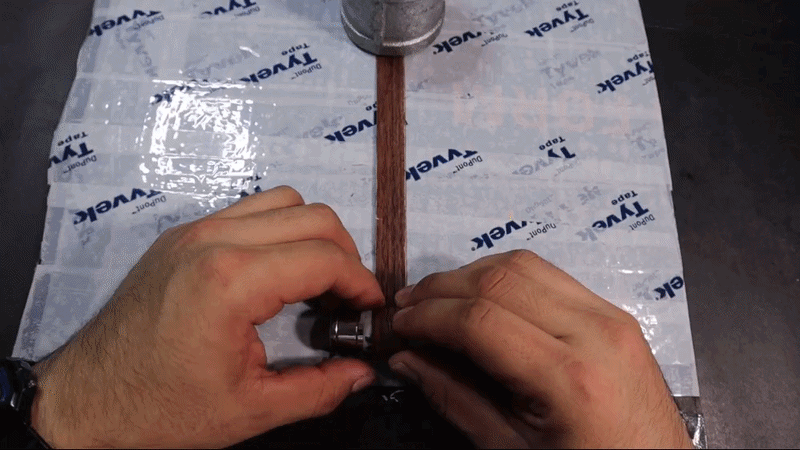 Process to make the ring involves cutting, rolling and gluing the NFC tags to the veneer strip.