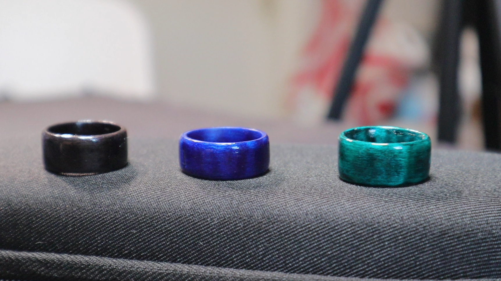 Close up picture showing three ring colors: black, blue and green.
