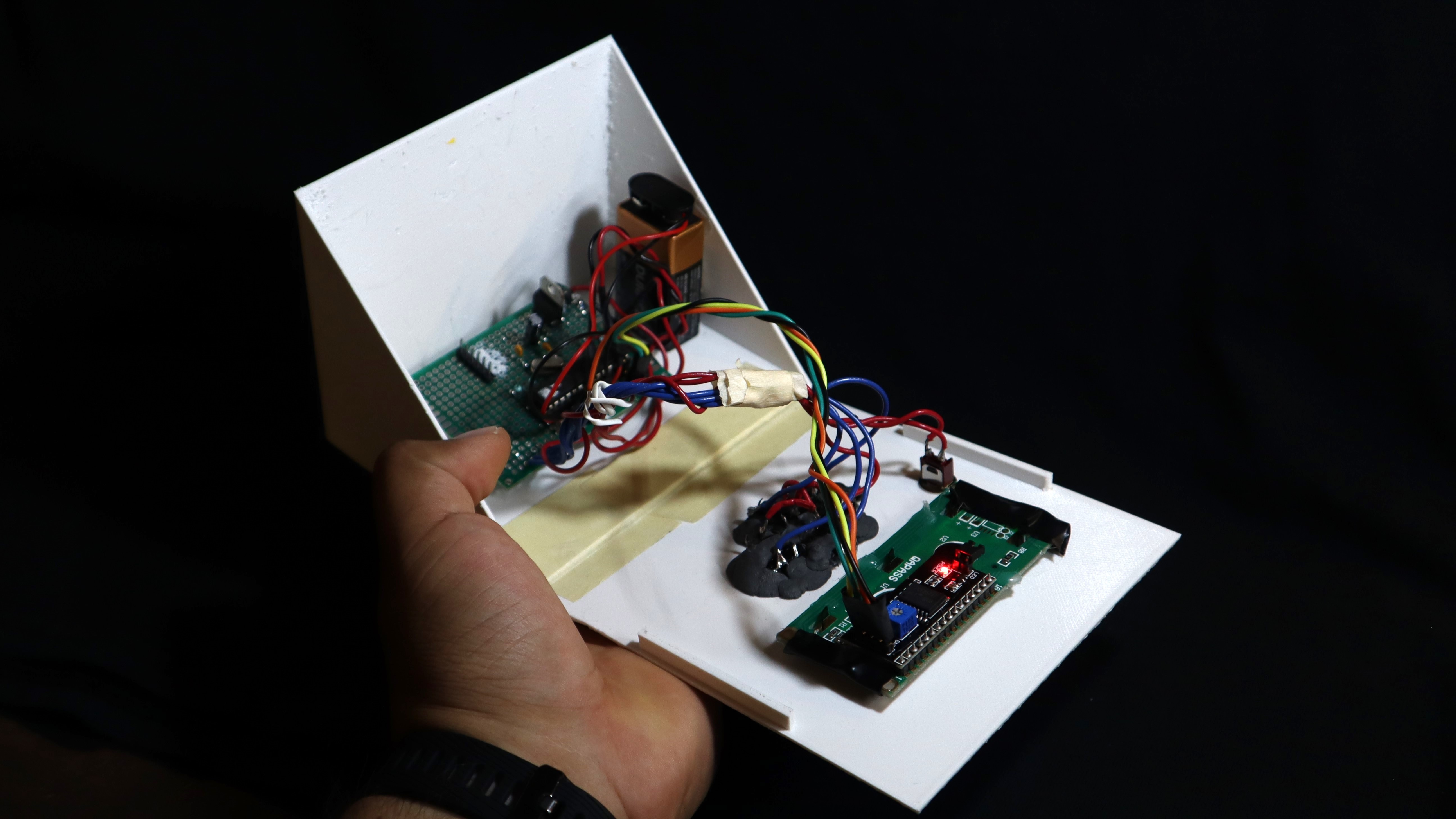 Internal wiring, LCD and main board shown mounted inside the enclosure.